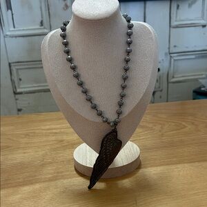 Elegant Brown Beaded Necklace with Wing Pendant